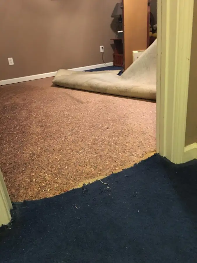 Carpet pad removal revealing water damage during Water Mitigation Services in Alamogordo